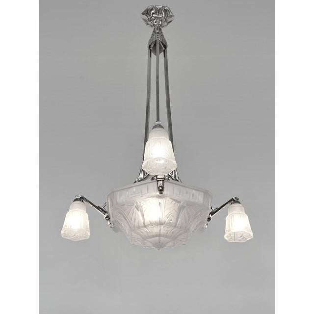 MAYNADIER A rare French 1930 art deco chandelier in nickel plated solid brass or bronze by Maynadier. Pierre Maynadier had...