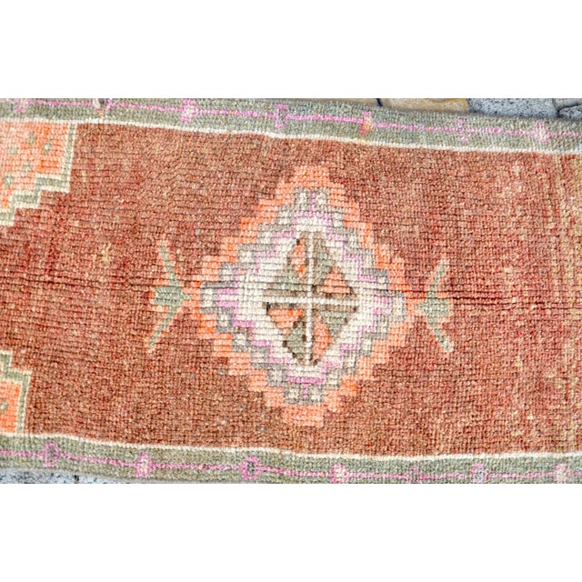 This is a vintage Turkish Oushak rug from the 1960s. The piece was hand-knotted.