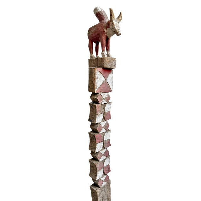 Antique Malagasy property post hand carved from a single piece of hardwood and mounted on a custom display stand....