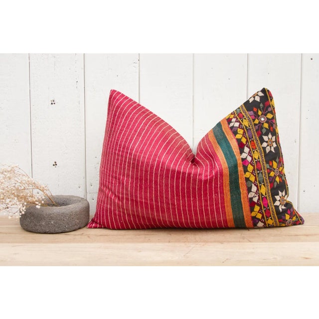 A beautiful Mashru silk lumbar pillow with a lovely embroidered tribal border of geometric and floral motifs. Mashru is...