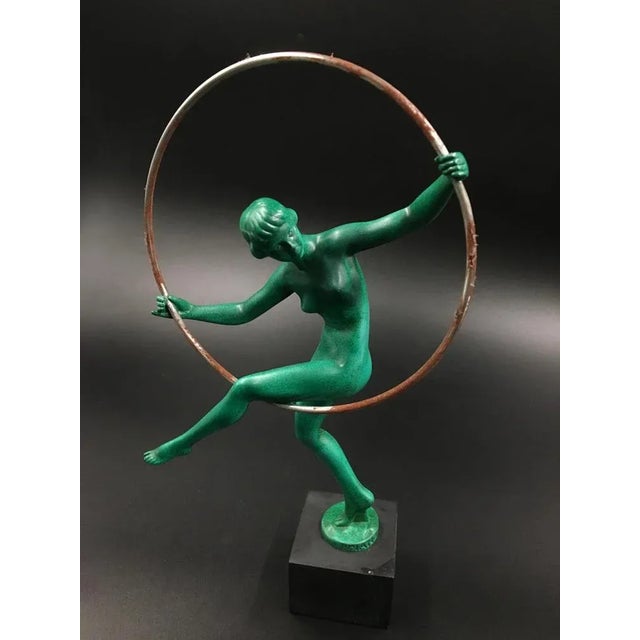 Art Deco figurine of woman playing with Hoop designed by "Briand" aka Marcel Buraine, in the Max le Verrier foundry,...