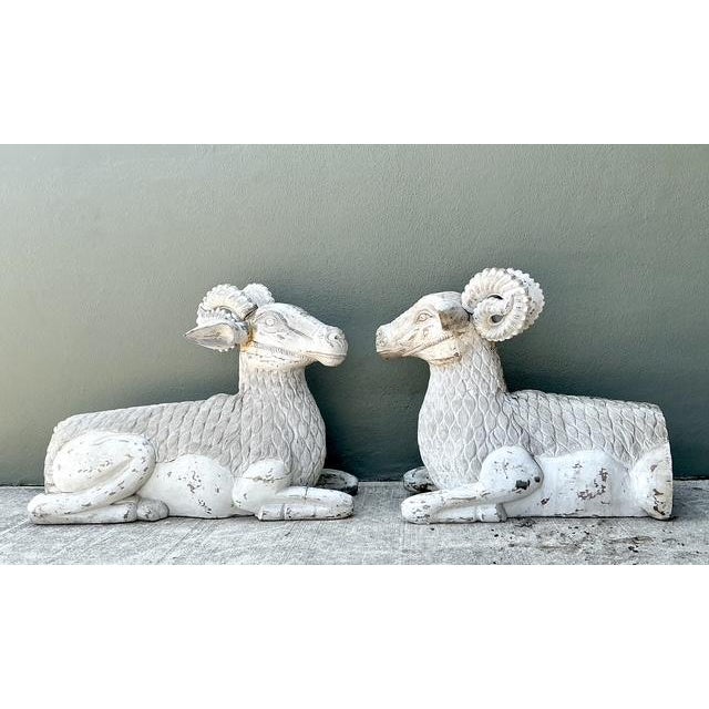 This exceptional pair of monumental hand-carved rams stands as a testament to rustic craftsmanship and grand-scale...