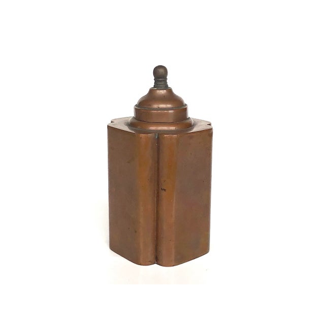 Pretty and practical, this vintage copper tea caddy does dual duty as a decorative accent for a shelf, desk, or table as...