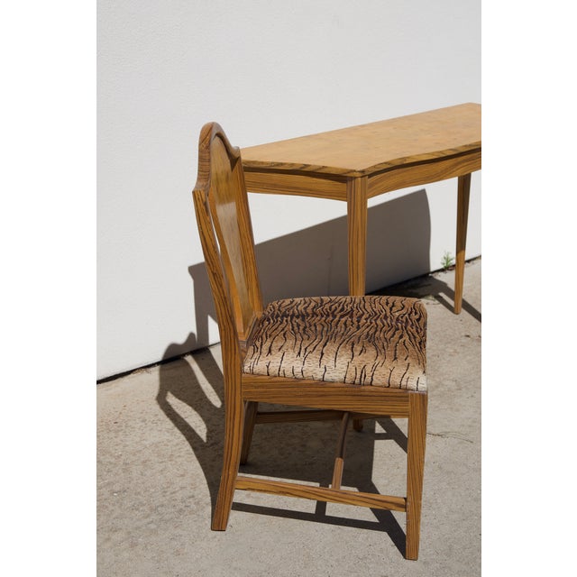 A matched Sheraton-style entryway console and side chair, made by a Southern California craftsman in striking zebrawood...