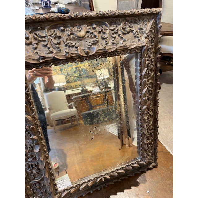 French early 19th c delicately carved frame with original mirror. 31” l x 35”h 49-008