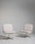 A collection of mid-century Space Age swivel chairs characterized by rounded forms and functional bases. These chairs...