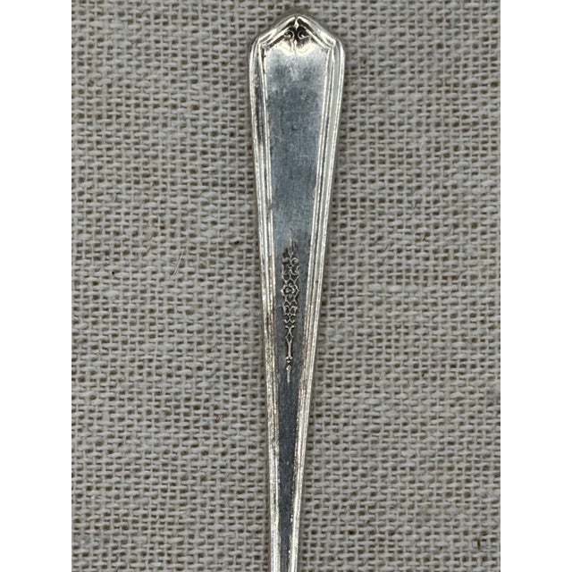 This is a set of 8 mini spoons. They are sterling silver by Towle Silsmiths, dated 1926 in an art deco Seville pattern...