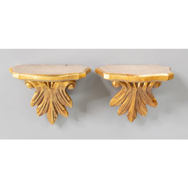 Mid-Century Italian carved acanthus leaf gilt wood wall brackets or shelves. Perfect for displaying decorative...