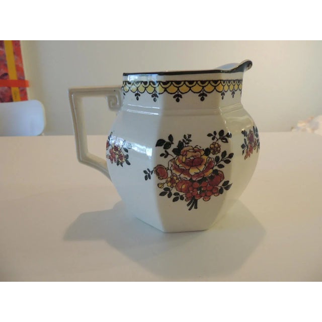 Vintage Floral Ceramic Milk Jug with Greek key detail handle. Made in England. Size: 6"W x 5"H x 5"D