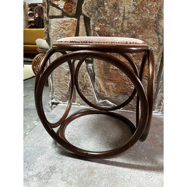 Adorable bentwood stool attributed to Michael Thonet. Versatile MCM accent upholstered in a dusty rose colored fabric....