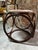 Adorable bentwood stool attributed to Michael Thonet. Versatile MCM accent upholstered in a dusty rose colored fabric....