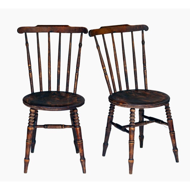 A very charming pair of Armless Antique wabi-sabi style spindle back side chairs with drumstick legs. It Could also be...