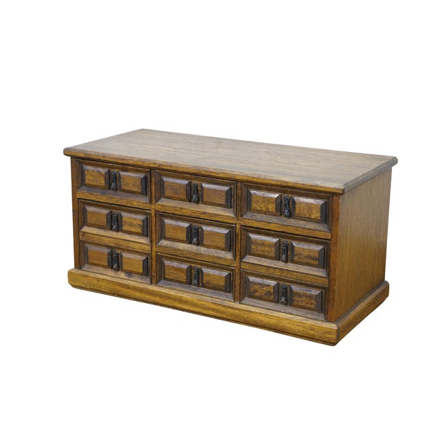 Circa 1960's walnut jewelry box / chest of seven drawers. Five small drawers and two deep drawers. Beveled fronts with...