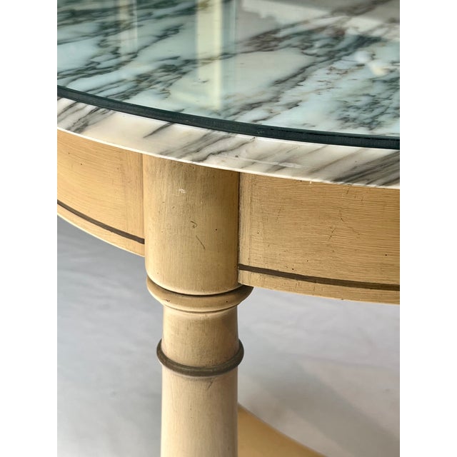 A classic late 20th-century Directoire revival round guéridon or accent side table. This stately piece features a premium,...