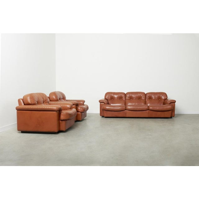 Dimensions Sofa: Width 225, depth 95, height 75, seat height 40 cm. Dimensions Chairs: Width 105, depth 100, height 75,...