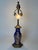 An exceptional and rare artist-signed rosenthal porcelain and brass table lamp, created in germany circa the 1920s,...