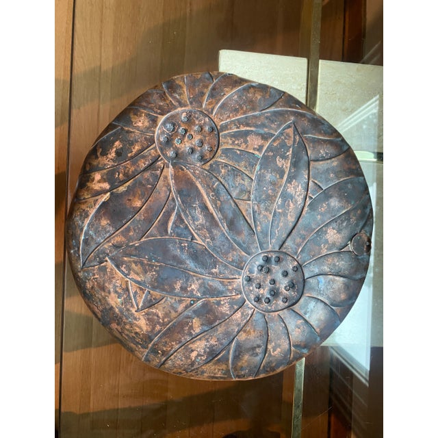 An original hand-made plate from Francisco Rebajes, made of pure copper with an indented sunflower motif and signed on the...