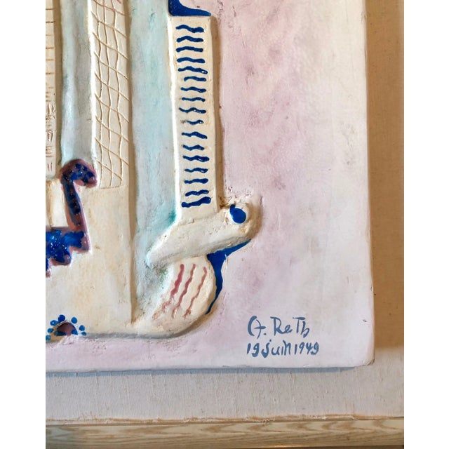 This is a plaster or ceramic relief sculpture with extensive hand painting in an enamel paint. hand signed and dated 1949....