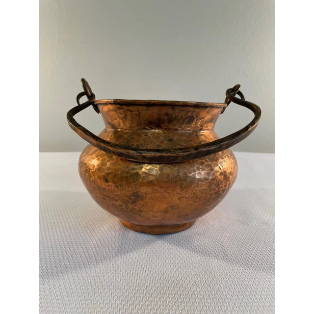 A fine hand forged and hammered Mid Century Copper Cachepot or Bucket with Handle. No markings. This beautiful rustic...