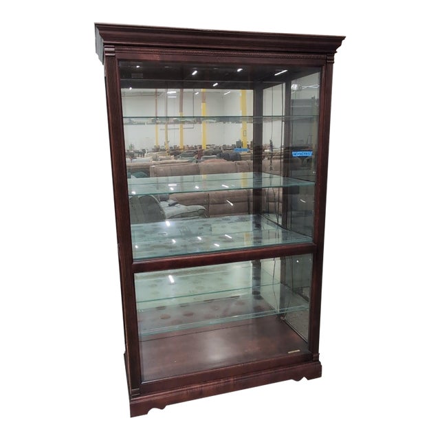 Howard Miller Townsend Lighted Curio Cabinet 680-235, Windsor Cherry With Mirrored Back For Sale