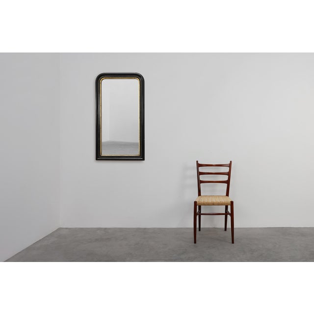 This elegant Louis Philippe mirror, crafted in France circa 1850, embodies the understated refinement of mid‑19th‑century...