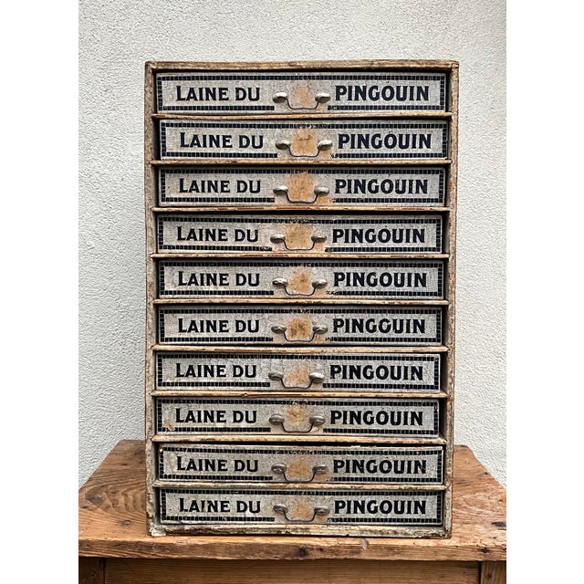 An exceptional French Art Deco haberdashery display cabinet produced during the late 1930s for Laine du Pingouin, one of...