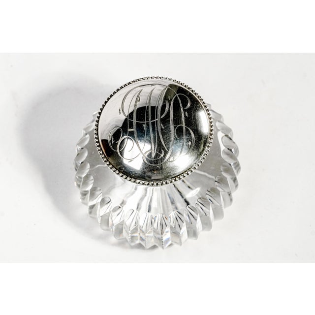 A magnificent example of early 20th-century elegance, this exceptional antique cut crystal and sterling silver inkwell...