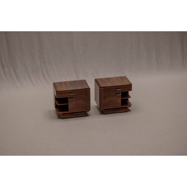 A refined and elegant set of vintage Art Deco side tables, defined by their soft, curved forms and balanced proportions....