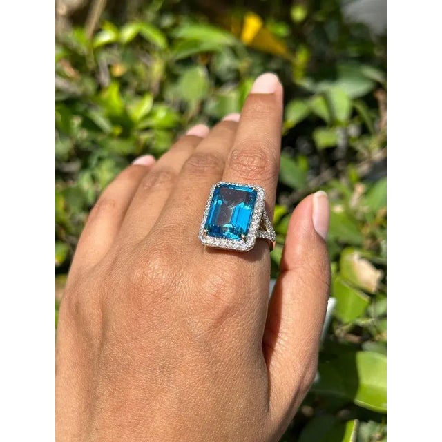 Large Blue Topaz Halo Diamond Cocktail Ring in 14K Gold featuring natural blue topaz of 15.41 carats and diamonds of 1.15...