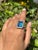 Large Blue Topaz Halo Diamond Cocktail Ring in 14K Gold featuring natural blue topaz of 15.41 carats and diamonds of 1.15...