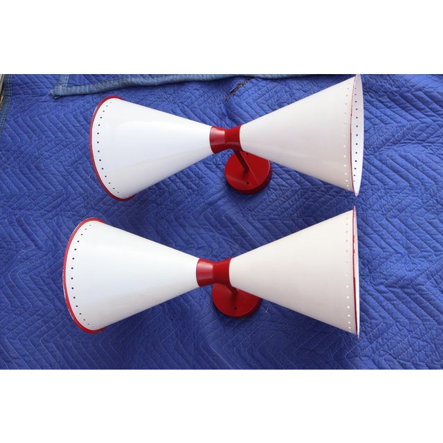 A pair of diabolo sconces in the manner of Jean Royere. Newly rewired.