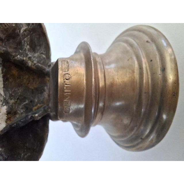 A refined vintage brass half-bust, depicting a young woman with an elaborate updo. The work, recovered from a stately...