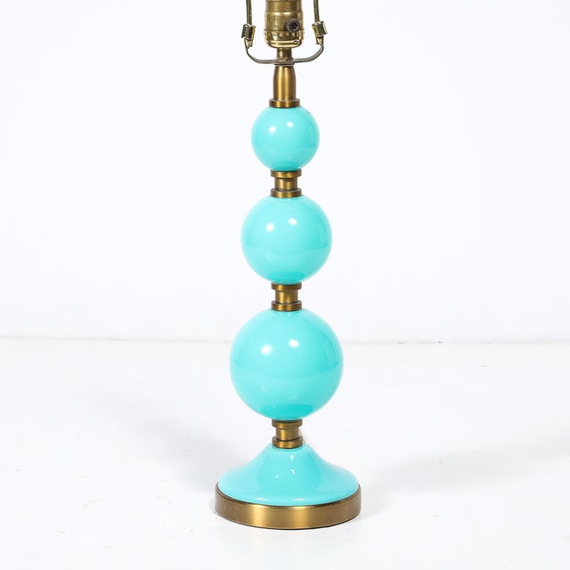 This Mid-Century Modernist table lamp, hand-blown in Murano, Italy, is a brilliant example of 20th-century Venetian glass...