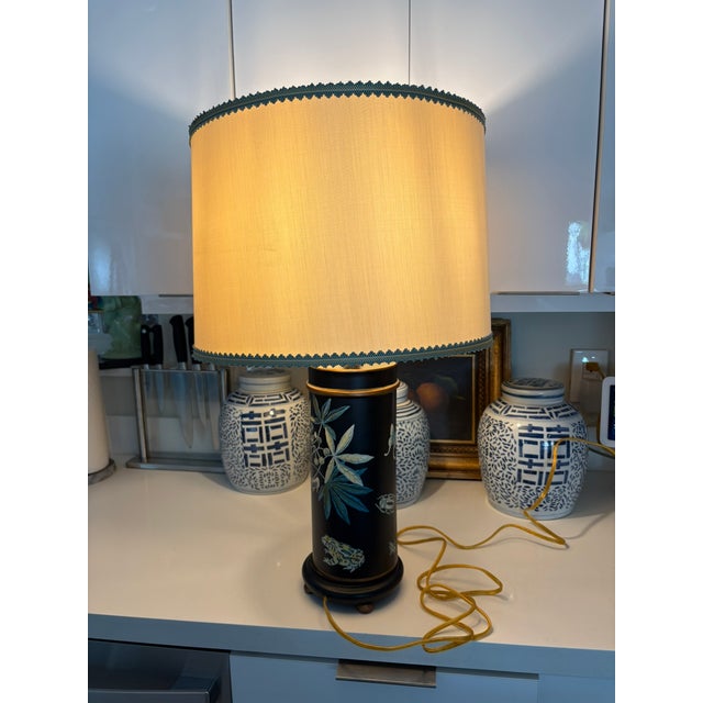 Vintage Fornasetti Style Black Tole Accent Lamp With Botanical & Animal Motifs Whimsical vintage table lamp with a matte...