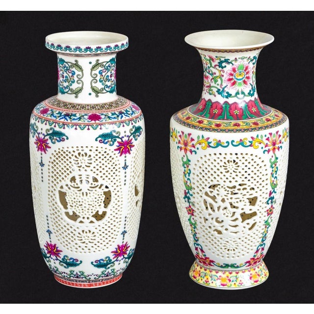 Group of Two Chinese Reticulated Porcelain Baluster Vases, 20th century, each with polychrome decoration and pierced...