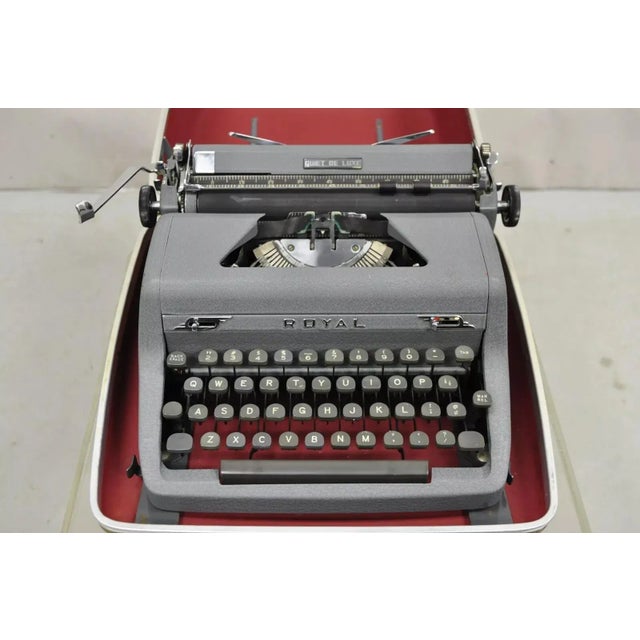 Vintage 1950's Royal Quiet De Luxe Mid Century Typewriter in Case. Circa Mid 20th Century. Measurements: Case 7" H x 14" W...