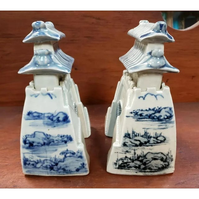 Up for sale is a Pair of Mid 20th Century Chinese Blue/White Porcelain Watch Tower Figurines. They each measure 6 5/16"...