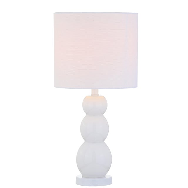 Update any interior with this elegant contemporary table lamp. it's rejuvenating white finish and chic shade defines it's...
