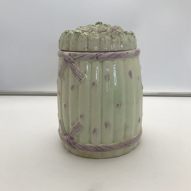 A charming vintage hand-painted bundled asparagus ceramic canister.