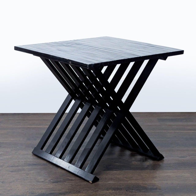 The table is composed of a combination of bamboo veneers and Gmelina wood. It is a high sheen ebonized table with a...
