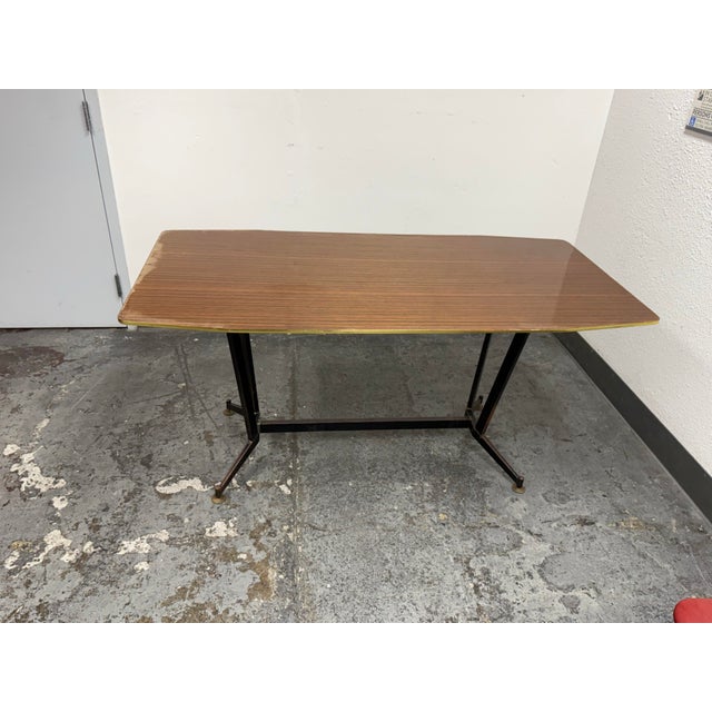 Design Plus Gallery presents the 1930's Italian Design Dining Table. The rectangular wood-grain top has softly rounded...