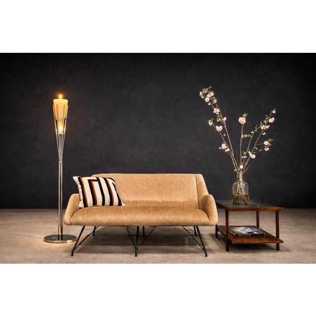 This mid-century chrome candle floor lamp is defined by its disciplined verticality and sculptural restraint. Rising from...