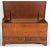 A fine 19th-century American walnut blanket chest, featuring a strap-hinged rectangular lid that opens to reveal a...