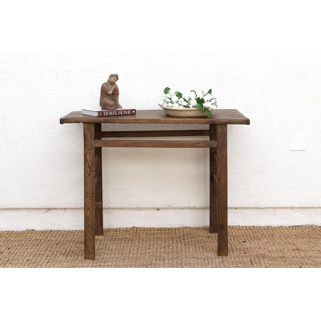 This is a piece where form meets spirit. Reconstructed from old wood, this altar console table carries with it the quiet...
