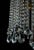 Brass chandelier with a rich cascade of crystal trimmings made of lead crystal. The trimmings are hand-cut and polished....