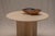 An elegant Italian travertine table from the 1970s, distinguished by its beautifully balanced proportions, sculptural...