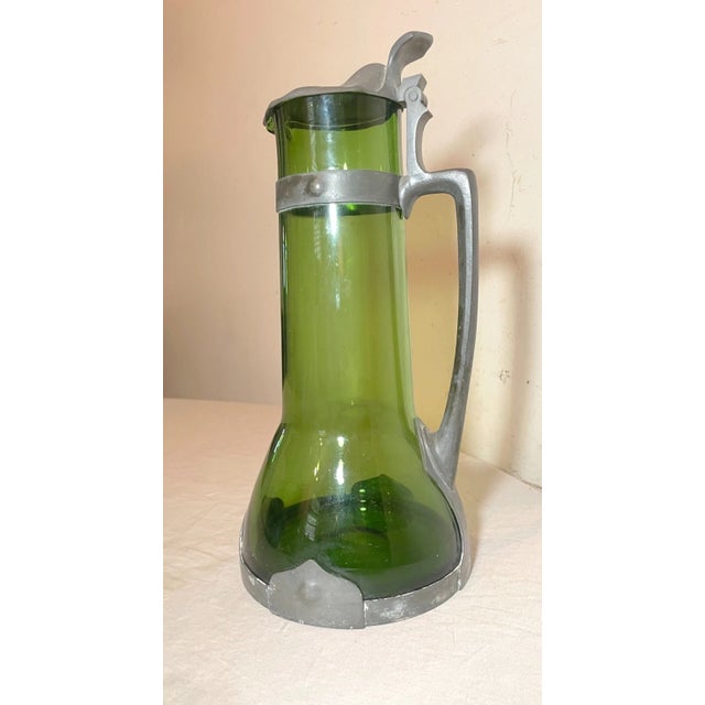 This antique German Arts and Crafts tankard pitcher from the 19th century is a must-have for collectors who appreciate...