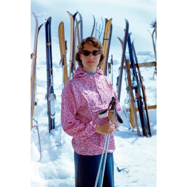 Zermatt Ski Fashion by Toni Frissell A colourful skier has her portrait taken at the bottom of the slopes in Zermatt,...