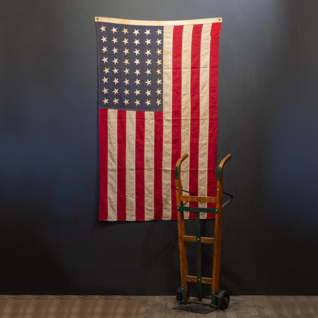 ABOUT An authentic, vintage 48-Star United States National Ensign flag. An ensign is a specific category of national flag...