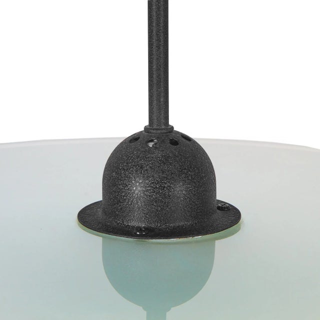 1980s modern saucer disc pendant hanging light with double glass discs and black housing. DIMENSIONS: Diagonal: 26 inches....